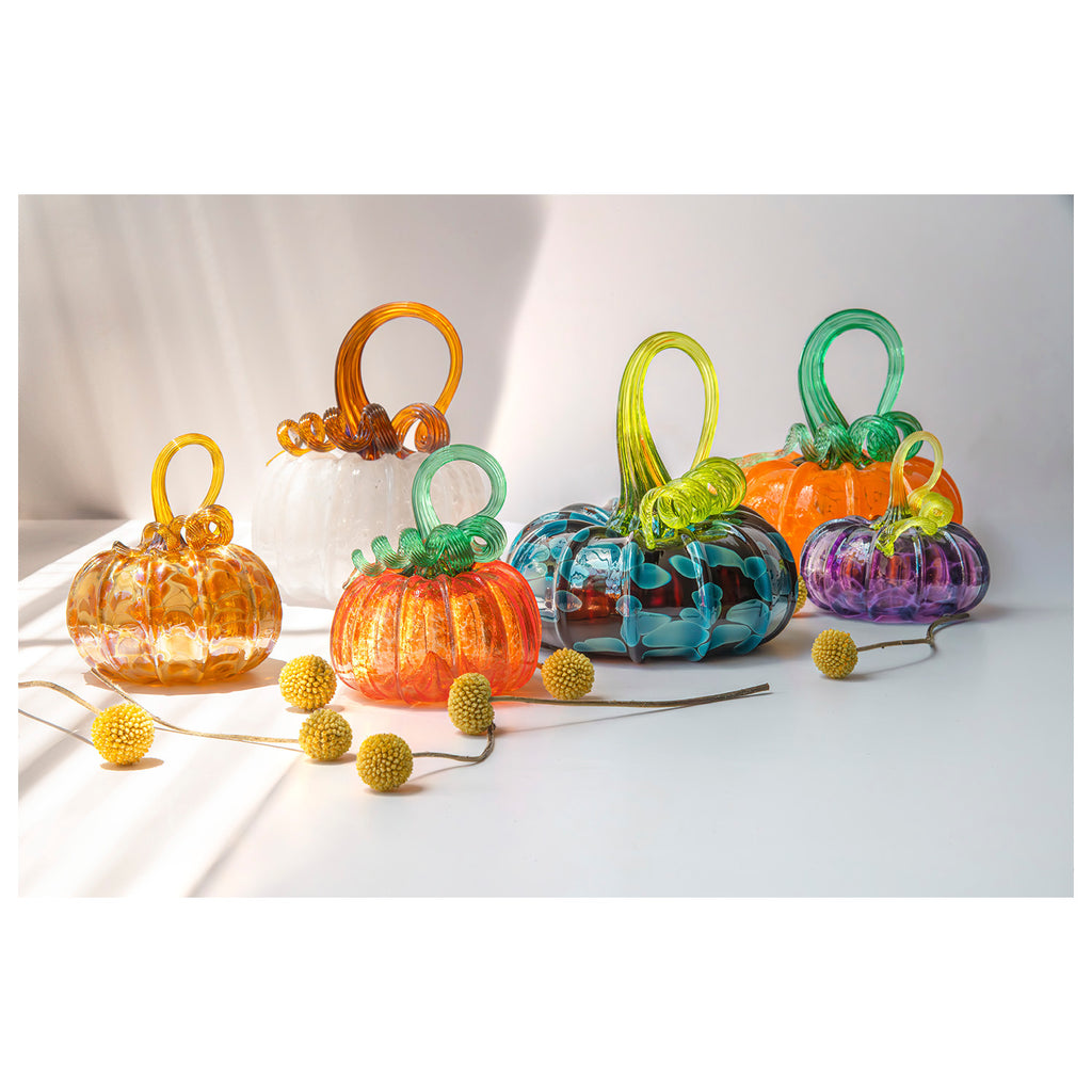 Colorful glass pumpkin on a white background