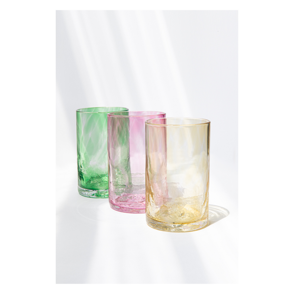 honey colored tumbler, basil green and pink seashell tumbler lined up on white background